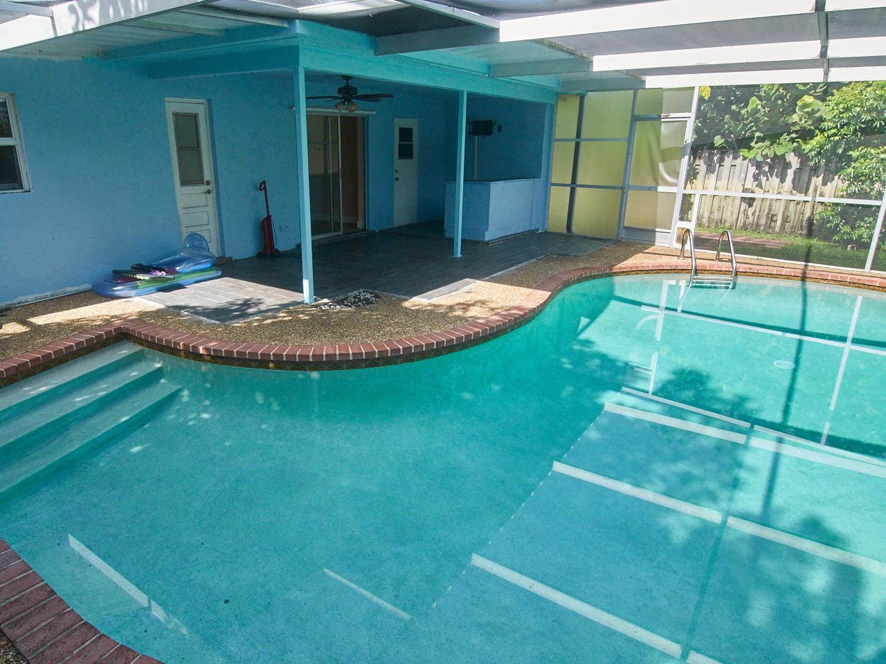 201 Northeast 28th Terrace Boca Raton, FL 33431 - Photo 17 of 36 Access door from pool to bathroom