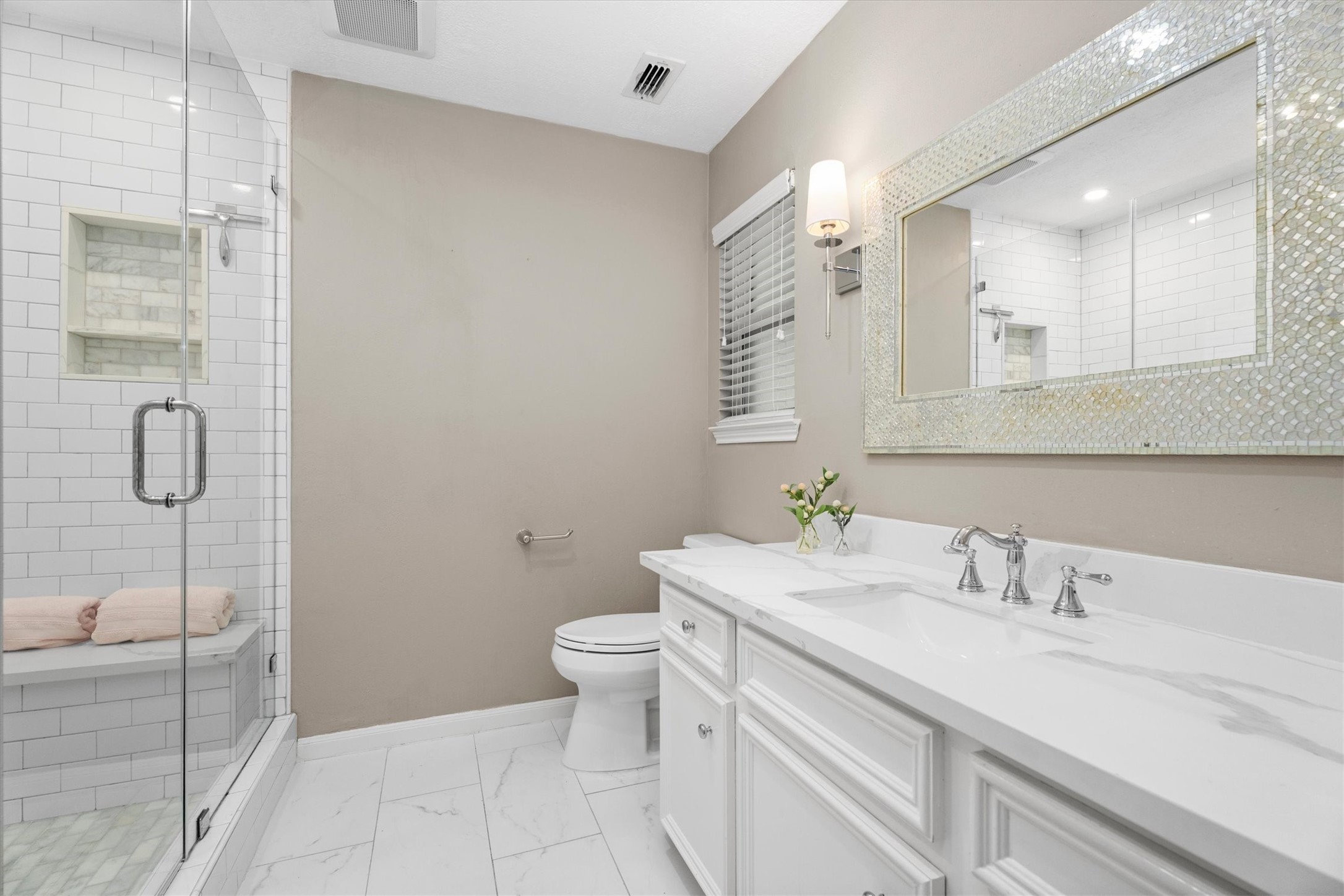 16267 Salmon Lane Spring, TX 77379 - Photo 34 of 48 This bathroom is a dream! Updated vanity, lighting, tile, fixtures, and a large, glass-enclosed shower with bench.