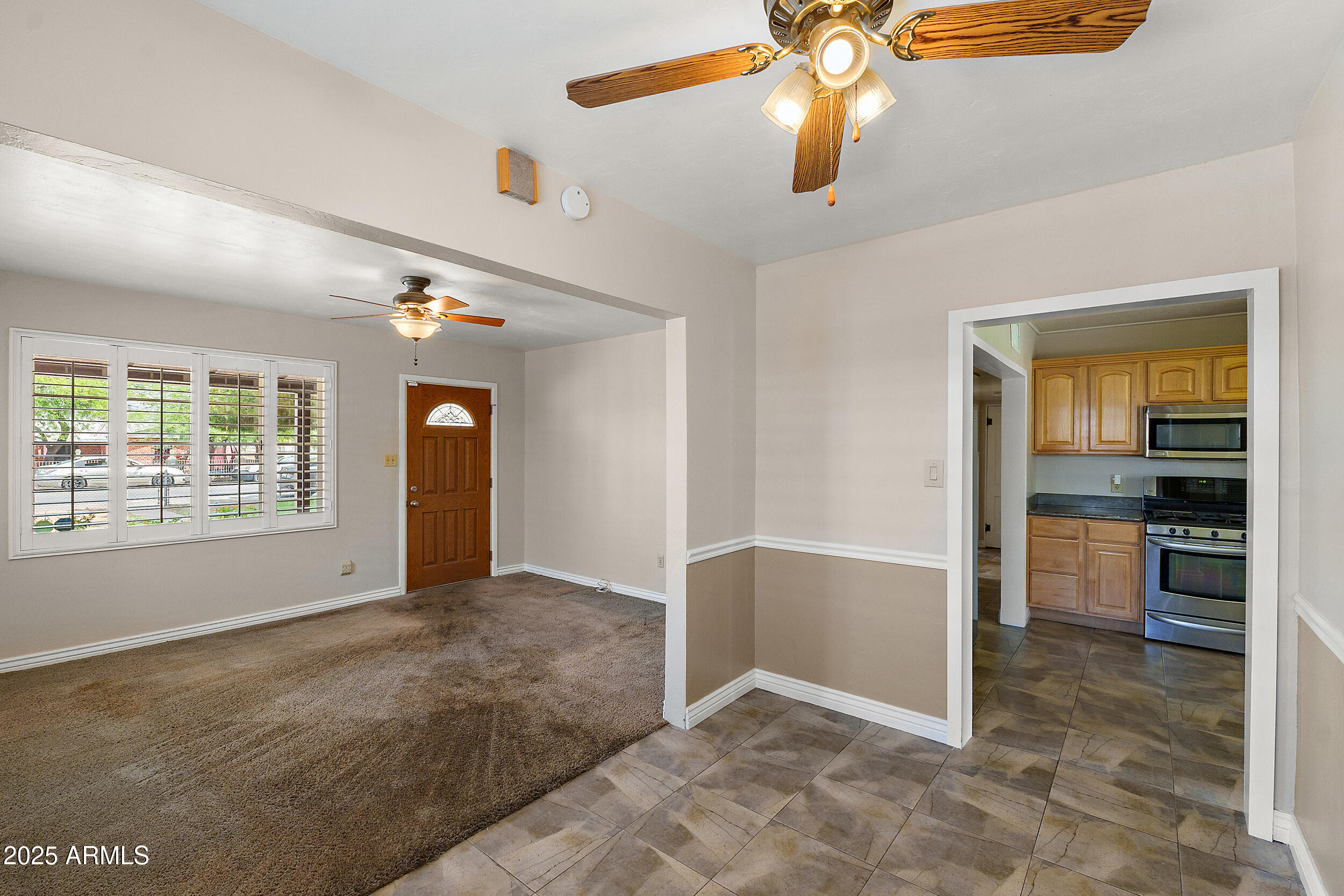 107 West Roeser Road Phoenix, AZ 85041 - Photo 3 of 25 Living Room, Dining Room, Kitchen