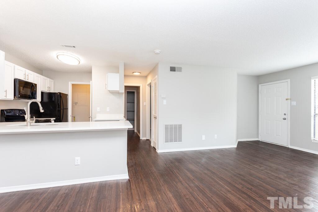 2701 Homestead Road, Unit B1 Chapel Hill, NC 27516 - Photo 12 of 25 a view of kitchen with cabinets and wooden floor