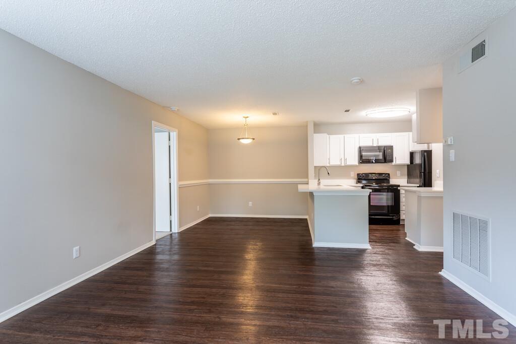 2701 Homestead Road, Unit B1 Chapel Hill, NC 27516 - Photo 15 of 25 a view of kitchen with refrigerator and microwave