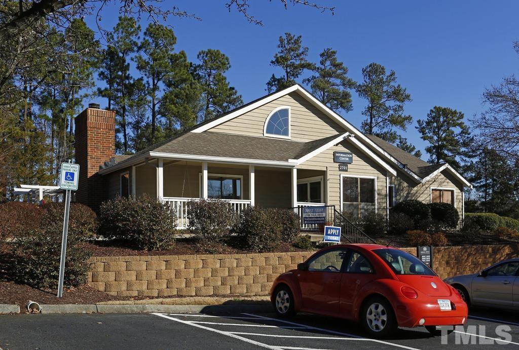 2701 Homestead Road, Unit B1 Chapel Hill, NC 27516 - Photo 23 of 25 a front view of a house with a yard
