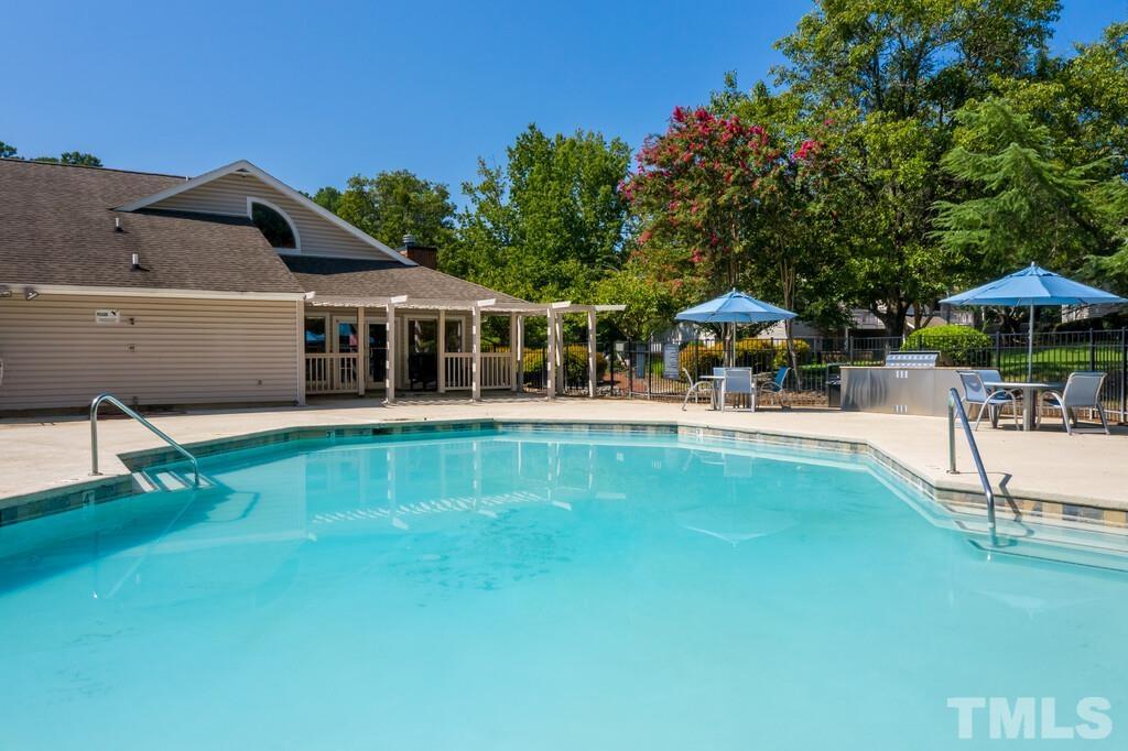 2701 Homestead Road, Unit B1 Chapel Hill, NC 27516 - Photo 4 of 25 a swimming pool with outdoor seating and yard