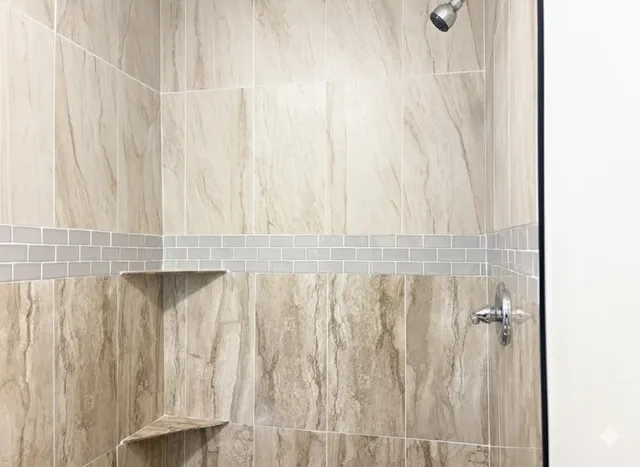 a white toilet sitting next to a bathroom sink