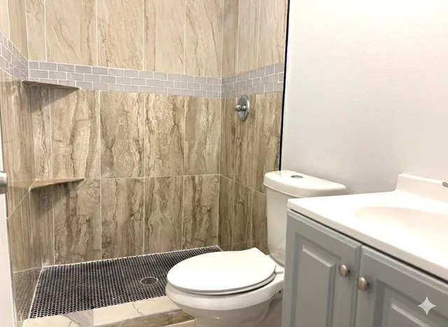 a bathroom with a toilet and a sink