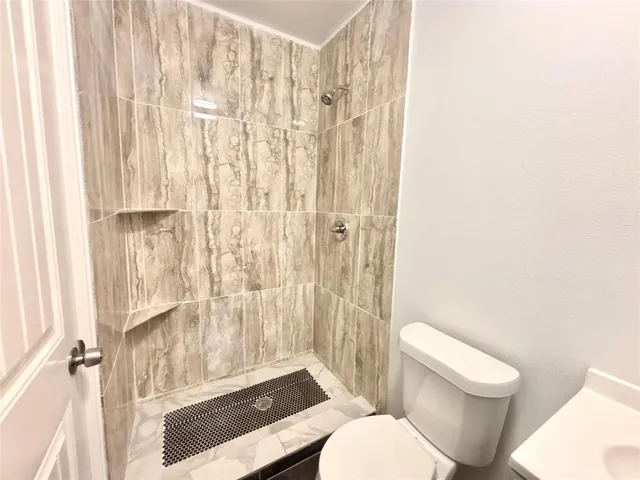 a bathroom with a bathtub and shower