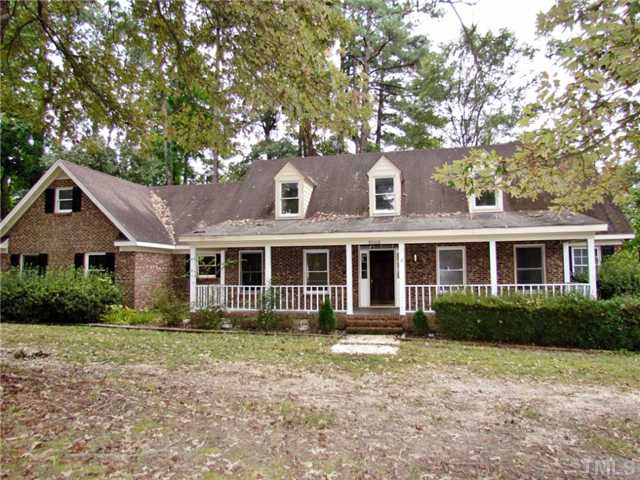 5000 Holly Ridge Farm Road Raleigh, NC 27616 - Photo 1 of 25 This is the Front View of the Larger Home (Home #1). Large Rocking Chair Front Porch the length of the home! Side Loading 2 car garage All Brick Home on almost 4 acres of Land! NO HOA rules & restrictions, NO City Taxes but within City, No Headaches! Exterior Front