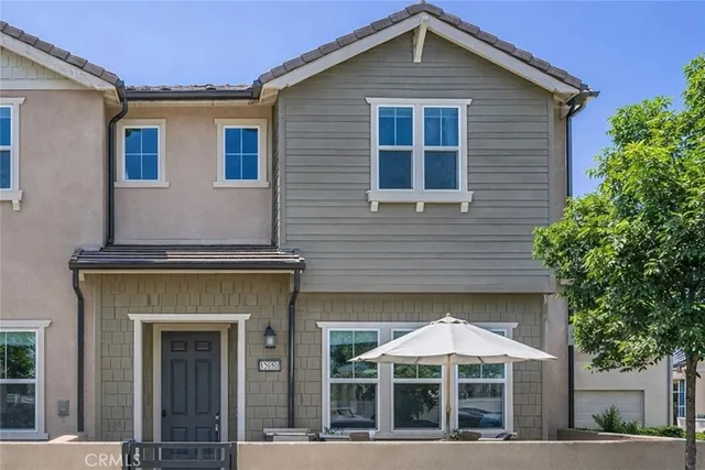 a front view of a house with large windows