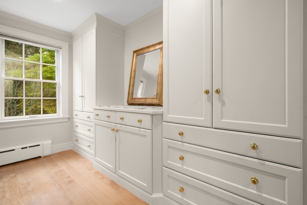 29 Cutler Road Hamilton, MA 01982 - Photo 20 of 42 a bathroom with a window sink and mirror