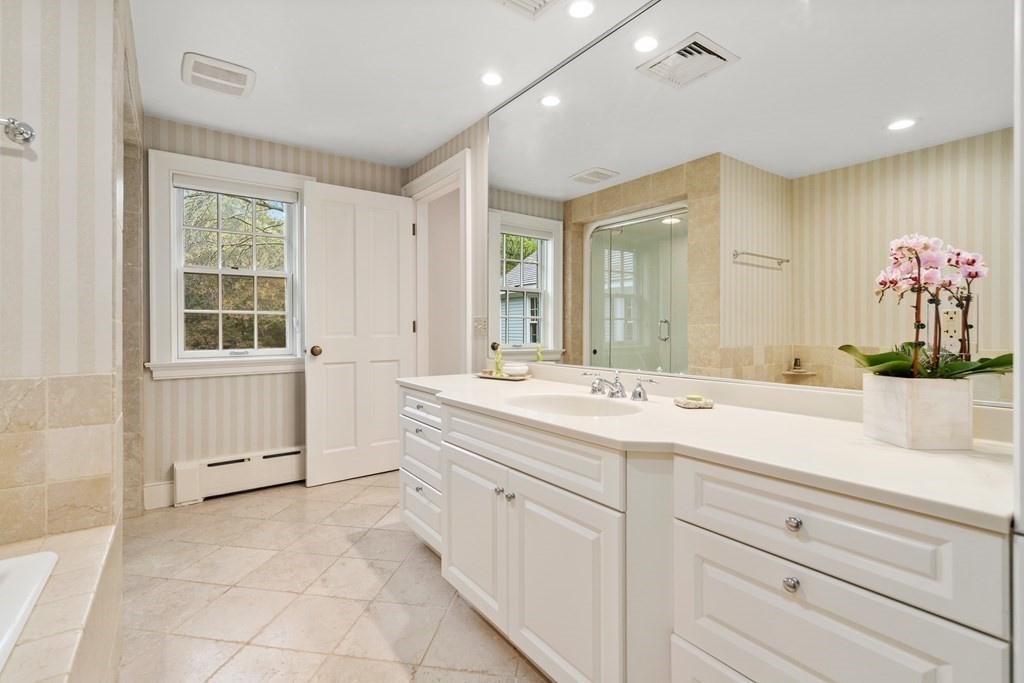 29 Cutler Road Hamilton, MA 01982 - Photo 21 of 42 a spacious bathroom with a granite countertop sink mirror and bathtub