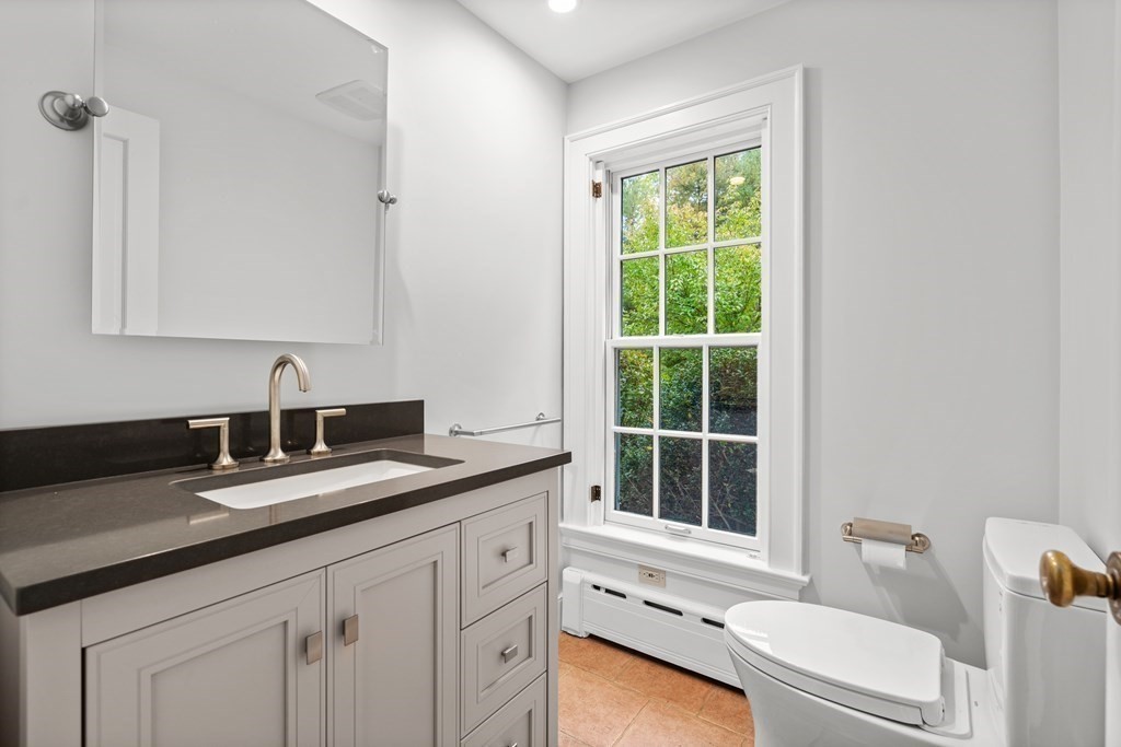 29 Cutler Road Hamilton, MA 01982 - Photo 31 of 42 a bathroom with a granite countertop sink and a window