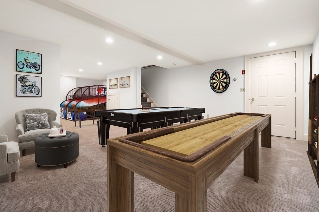 29 Cutler Road Hamilton, MA 01982 - Photo 33 of 42 a room with table and flat screen tv