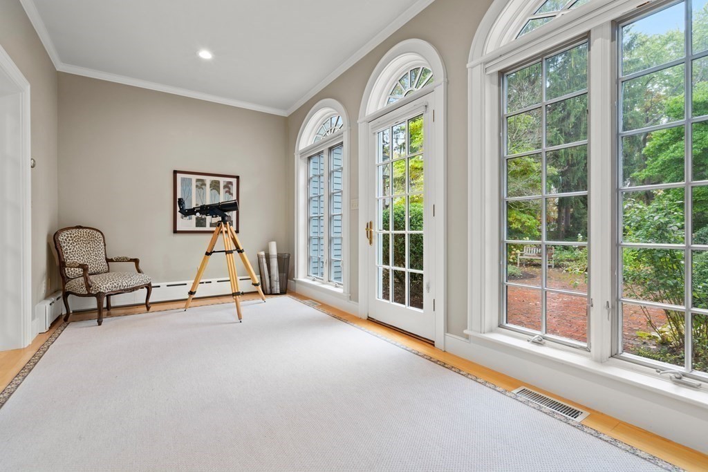 29 Cutler Road Hamilton, MA 01982 - Photo 34 of 42 a view of a livingroom with a large window and a swimming pool