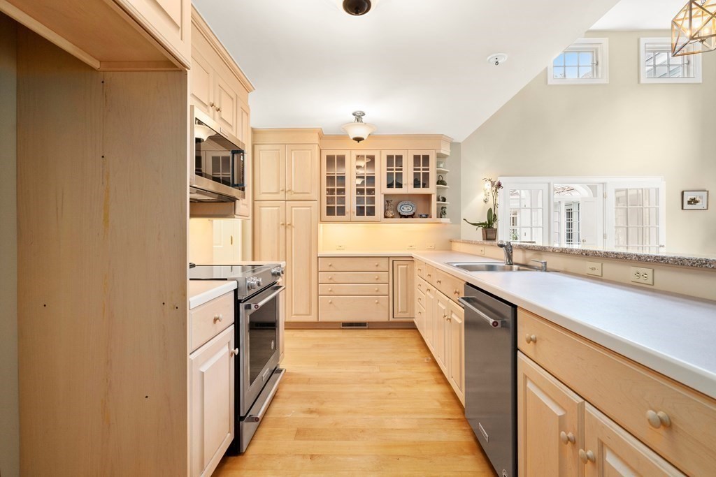 29 Cutler Road Hamilton, MA 01982 - Photo 36 of 42 a large kitchen with stainless steel appliances granite countertop a lot of counter space and a sink