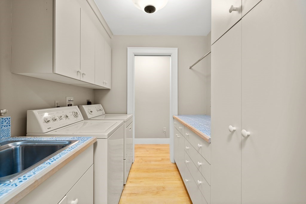 29 Cutler Road Hamilton, MA 01982 - Photo 38 of 42 a bathroom with a sink and a washing machine