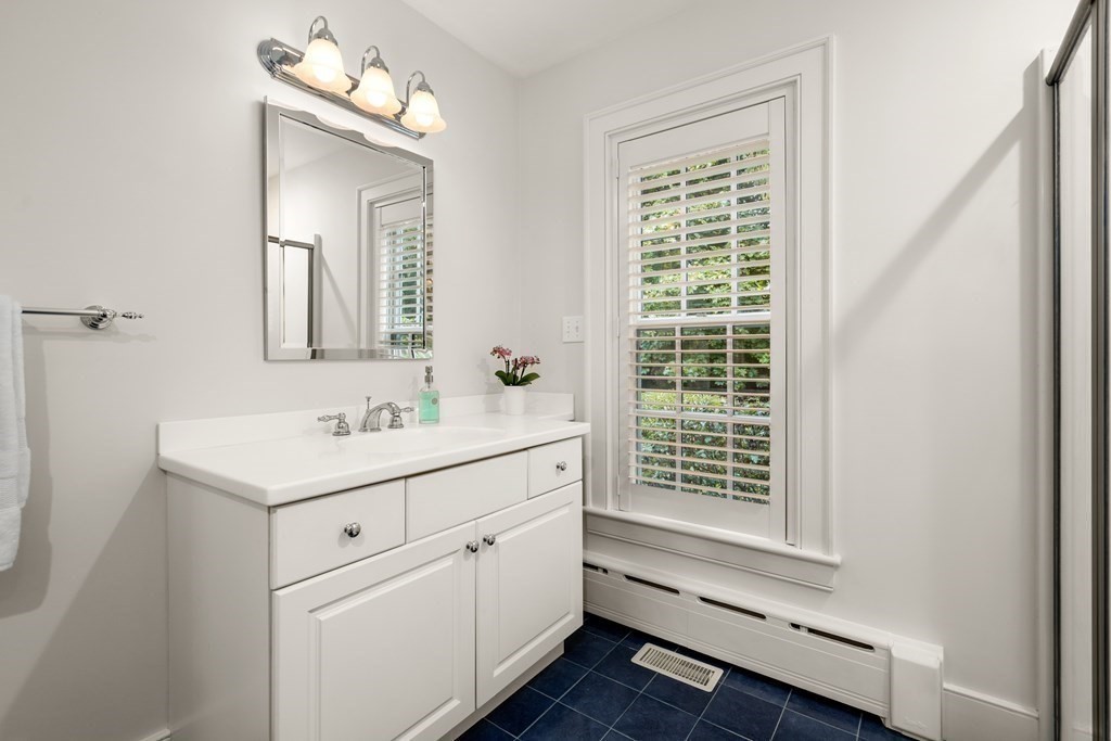 29 Cutler Road Hamilton, MA 01982 - Photo 40 of 42 a bathroom with a sink a vanity and a mirror