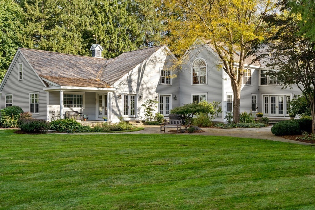 29 Cutler Road Hamilton, MA 01982 - Photo 6 of 42 a front view of a house with a garden