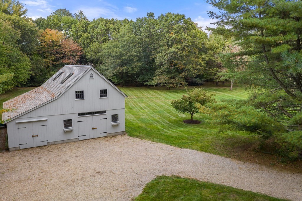 29 Cutler Road Hamilton, MA 01982 - Photo 10 of 42 a view of a backyard with a garden