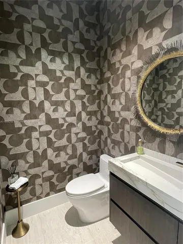 a bathroom with a toilet and a sink