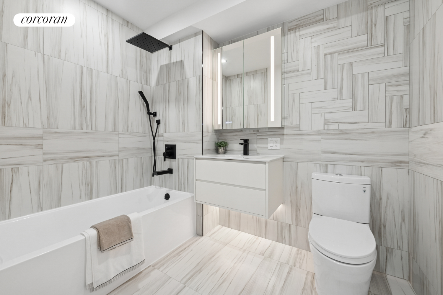 428 East 9th Street, Unit 703 Brooklyn, NY 11218 - Photo 5 of 24 a bathroom with a sink a toilet and bathtub