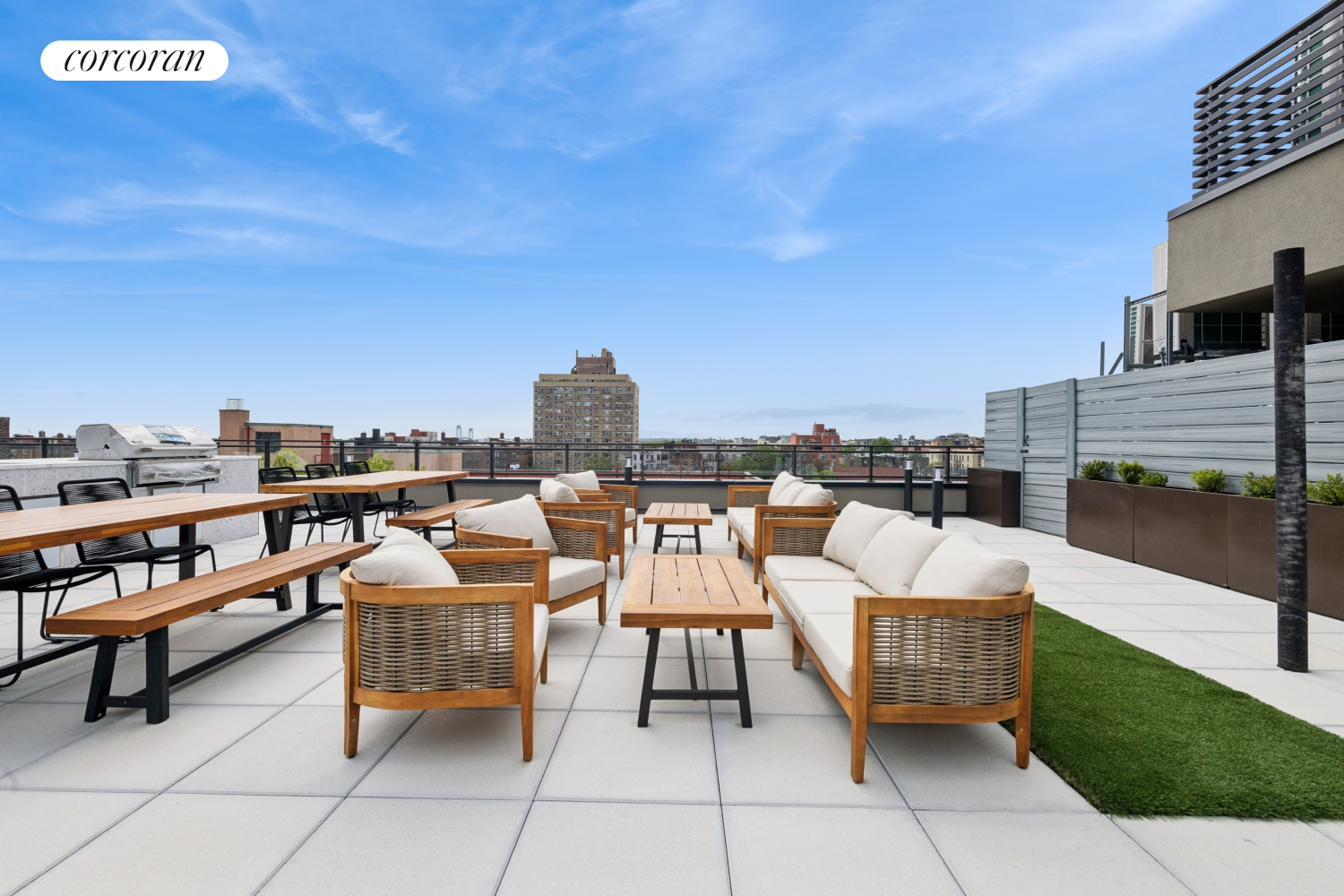 428 East 9th Street, Unit 703 Brooklyn, NY 11218 - Photo 8 of 24 a terrace with outdoor seating and city view