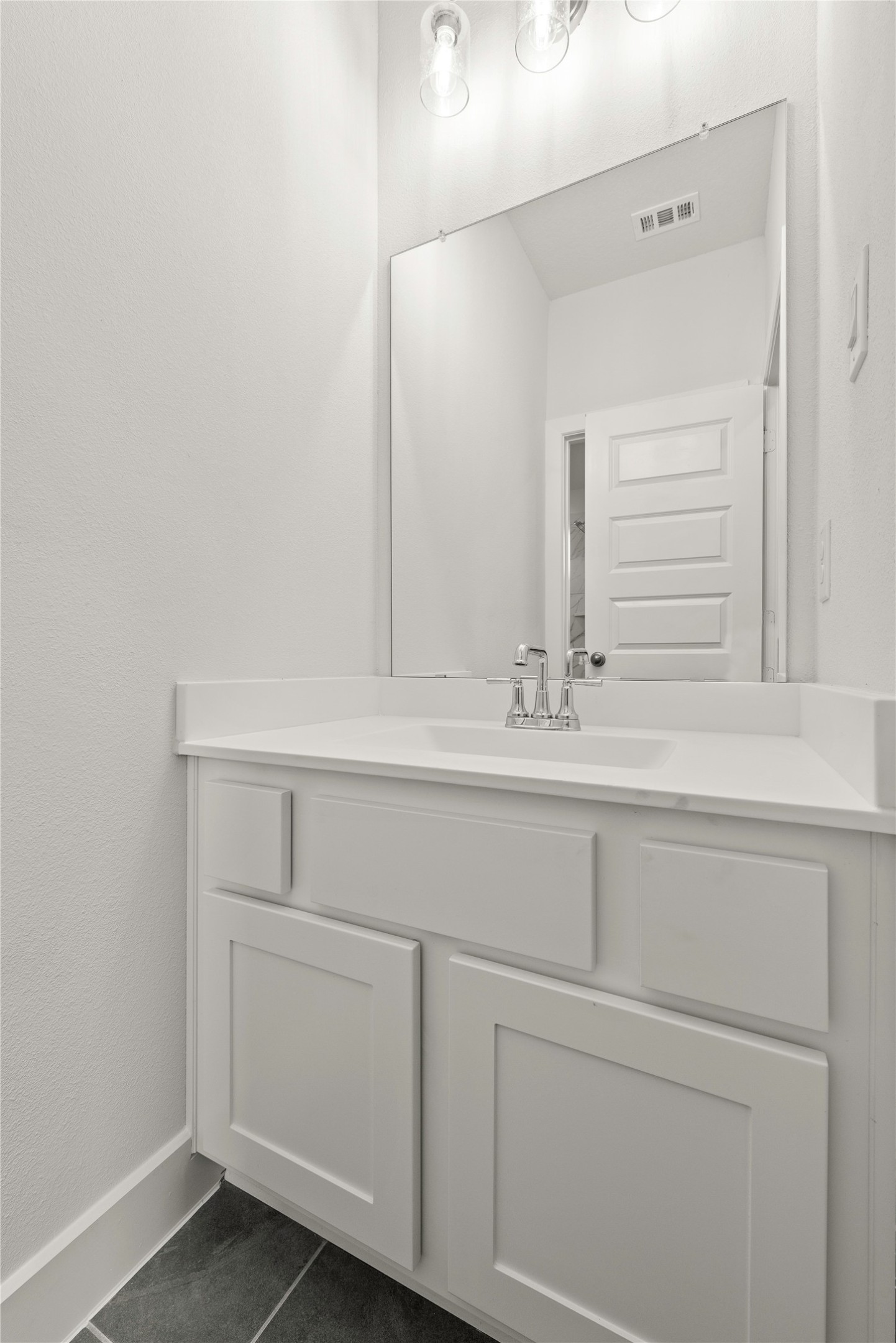 18917 Moonriver Street Conroe, TX 77302 - Photo 20 of 28 a bathroom with a sink and cabinets