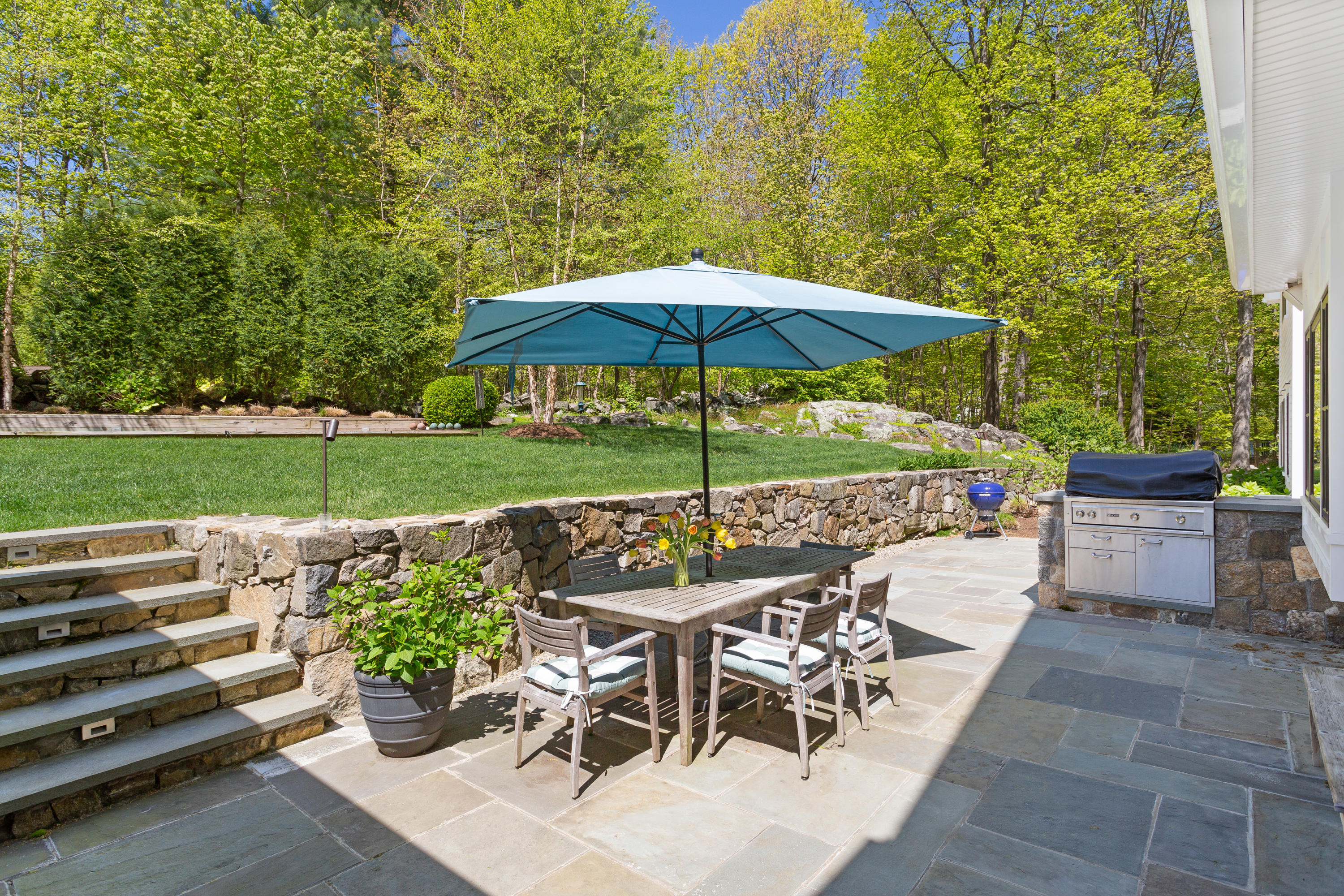 9 Canoe Trail Darien, CT 06820 - Photo 23 of 28 a view of a chairs and table in the garden