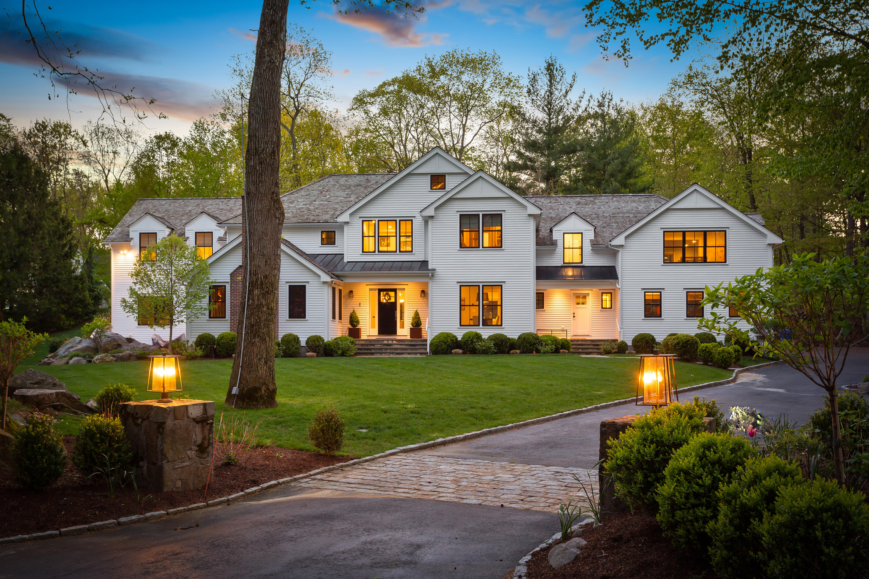 9 Canoe Trail Darien, CT 06820 - Photo 25 of 28 a front view of a house with a yard and garage