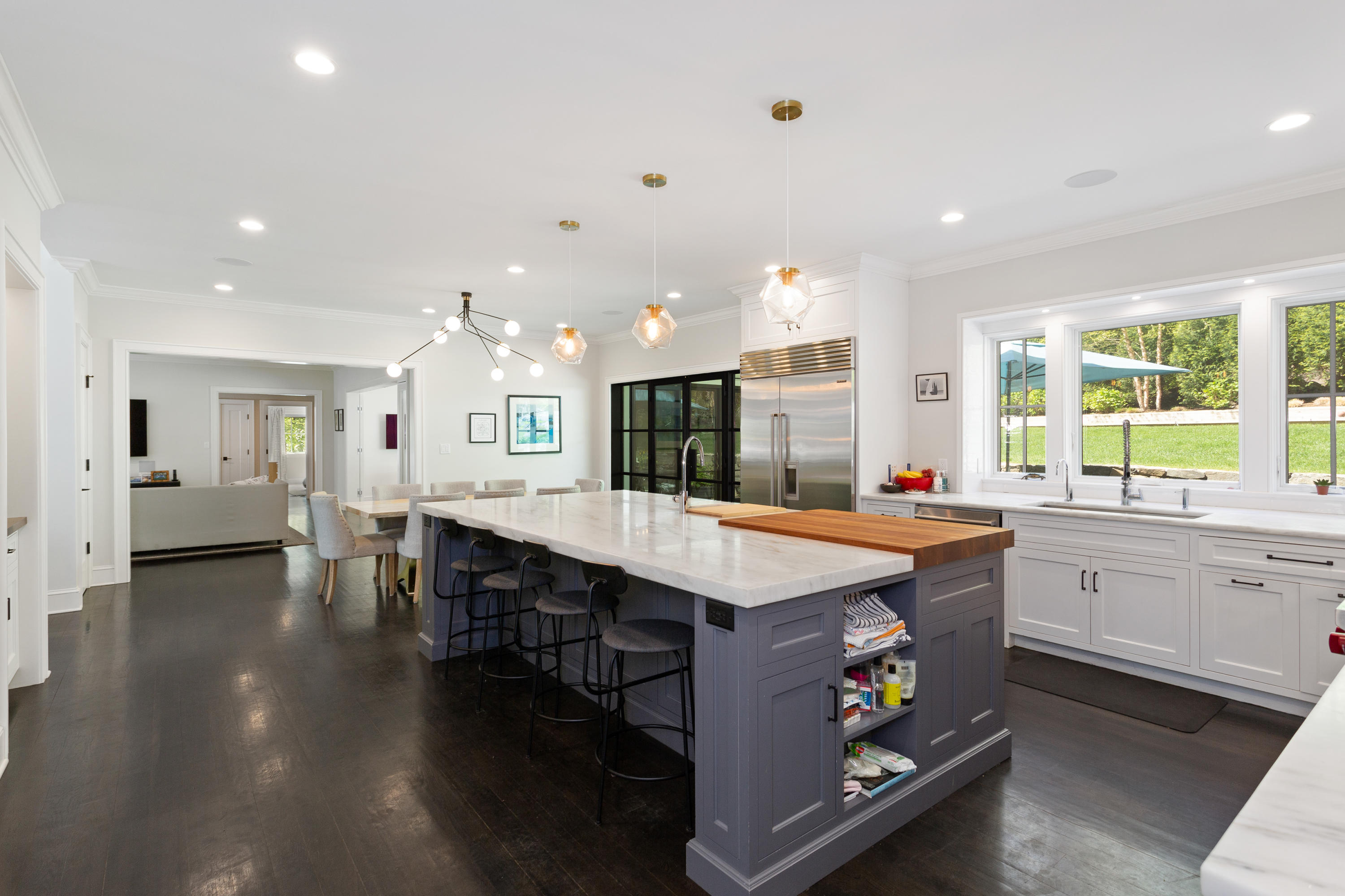 9 Canoe Trail Darien, CT 06820 - Photo 5 of 28 a large kitchen with kitchen island a sink table and chairs