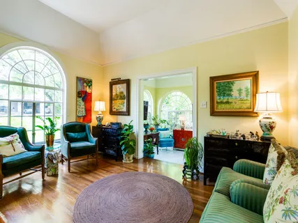 a living room with furniture and a large window