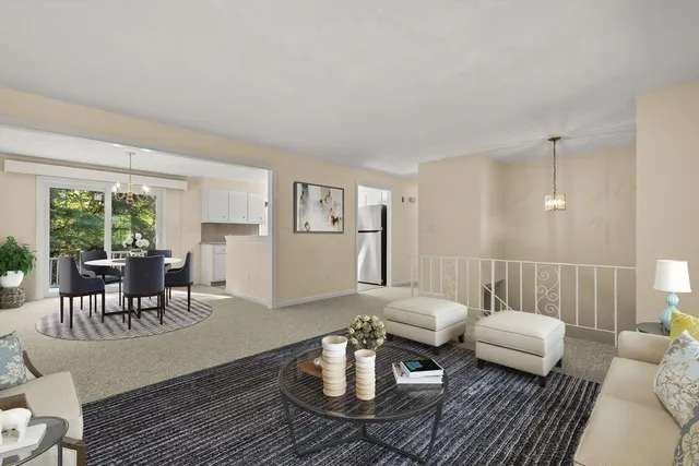 a living room with furniture and a table