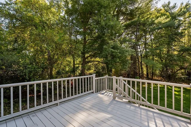 a view of deck with wooden floor and fence