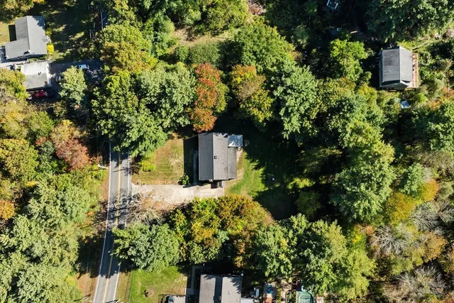 a backyard of a house with lots of green space
