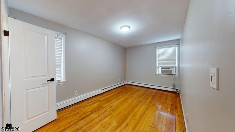 40 Howard Street, Unit 1 Bloomfield, NJ 07003 - Photo 15 of 21 wooden floor in an empty room with a window