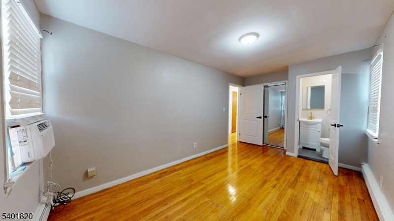 40 Howard Street, Unit 1 Bloomfield, NJ 07003 - Photo 16 of 21 a big room with wooden floor and windows