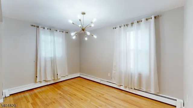 a view of a room with racks on the wall and a window