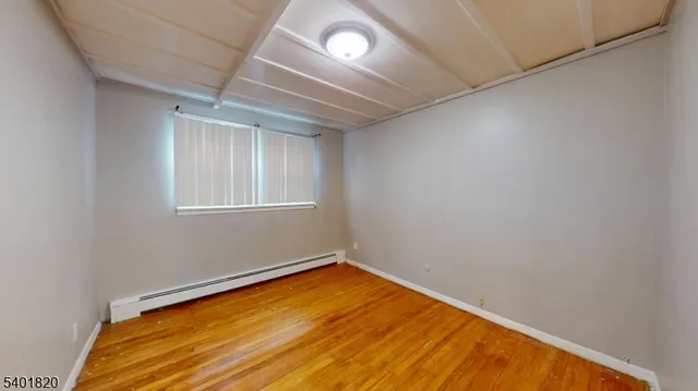 an empty room with a empty space and windows