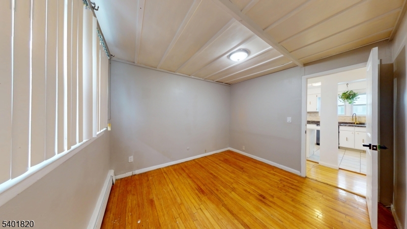 40 Howard Street, Unit 1 Bloomfield, NJ 07003 - Photo 10 of 21 a view of empty room with wooden floor