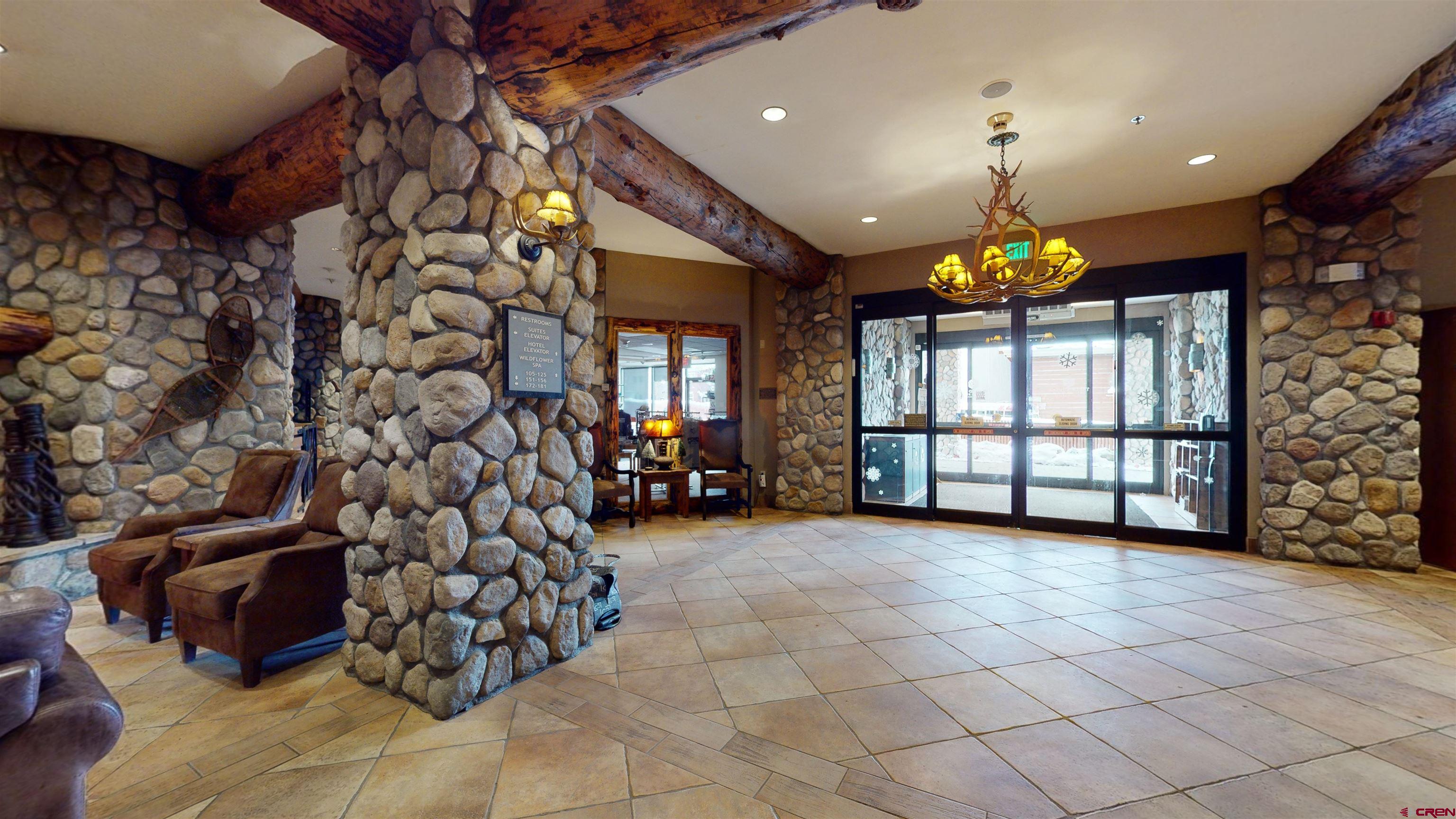 6 Emmons Road, Unit 317 Crested Butte, CO 81225 - Photo 17 of 19 a view of a room with lots of windows and chandelier