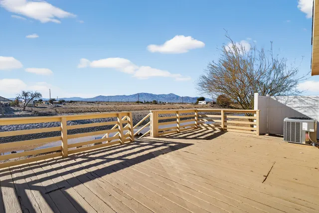 a view of swimming pool with outdoor seating and plants