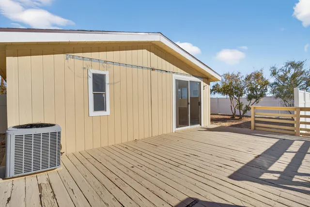a bedroom with a bed and a barbeque