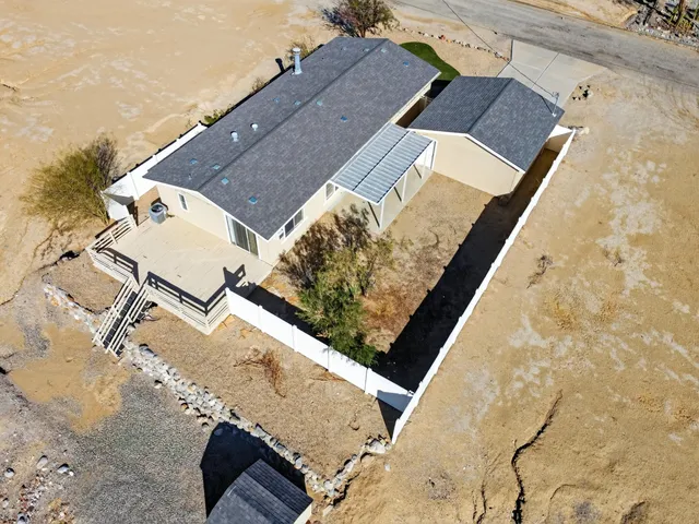 view of a house with a backyard