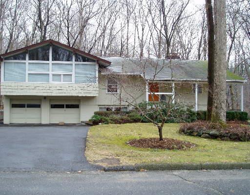 126 Gary Road Stamford, CT 06903 - Photo 1 of 1 a front view of a house with a yard