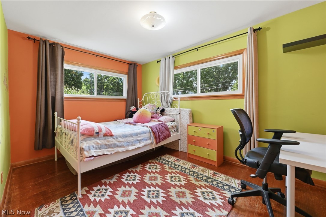 1499 Morris Road Kent, OH 44240 - Photo 11 of 41 Bright room featuring wood-finish flooring, white trim windows, and a ceiling-mounted light fixture