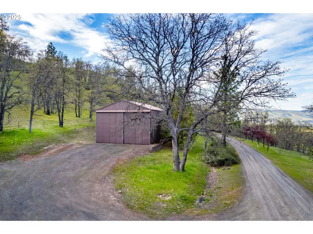 a backyard of a house with lots of green space