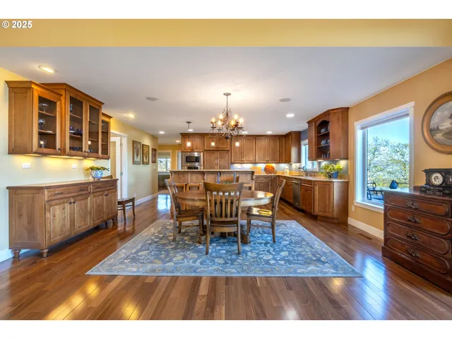 a living room with dining room and kitchen view
