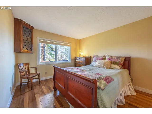 a bedroom with a bed and a desk