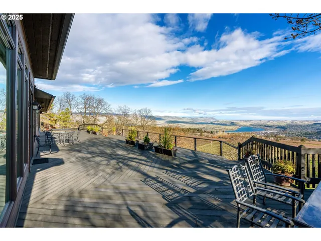 a view of a balcony with wooden floor