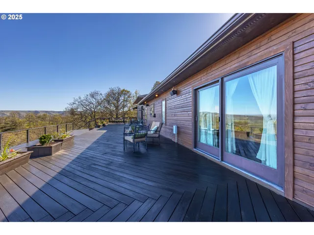 a view of outdoor space with deck and living room
