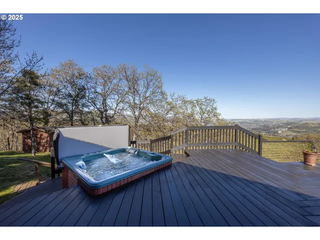 a view of a terrace with wooden floor and lake view